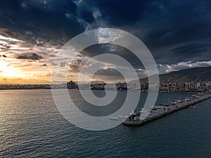 Aerial iconic sunset view over the port of Kalamata seaside city in Messenia, Greece