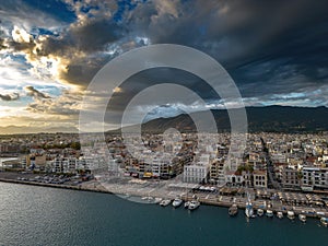 Aerial iconic sunset view over the port of Kalamata seaside city in Messenia, Greece