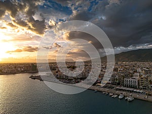 Aerial iconic sunset view over the port of Kalamata seaside city in Messenia, Greece