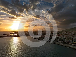 Aerial iconic sunset view over the port of Kalamata seaside city in Messenia, Greece