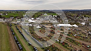 Aerial image of Amish Mud Sale, shows a display farm machinery, equipment rural exhibition field