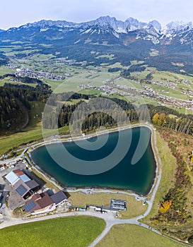Aerial image of the Astbersee lake with Wilder Kaiser mountain