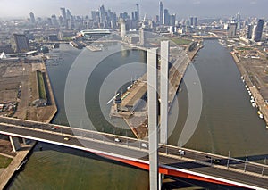 Aerial image of the Bolte Bridge over Docklands and the city of Melbourne in the background.