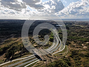 Aerial image of ecoduct crossing highway in dunes national park in the Netherlands