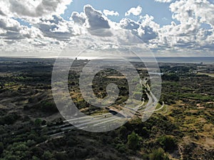 Aerial image of ecoduct crossing highway in dunes national park in the Netherlands