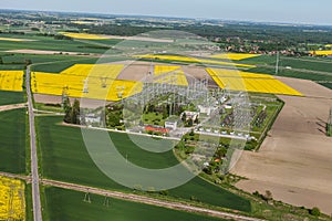 Aerial image of electrical substation featuring wires, transform