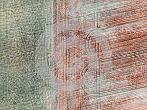 Aerial image of farmland with tractor wheel patterns