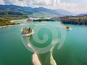 Aerial image of Lake of Gruyere with ruins castle of Pont