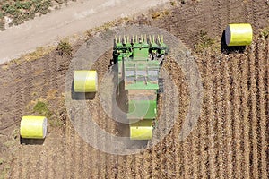 Aerial image of a Large Cotton picker harvesting a field.