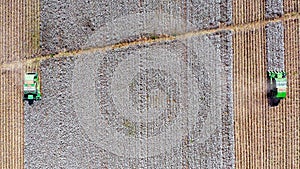 Aerial image of a Large Cotton picker harvesting a field.
