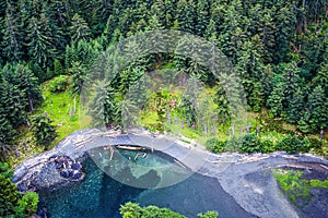 An aerial image of the Ninstints village on Haida Gwaii, BC, Canada