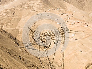 Aerial image of power line tower in Lima Peru. desert hills of the andes.