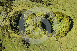 Aerial image of typical green volcanic caldera crater landscape resembling 2 eyes like a minion with volcano cones of Planalto da photo