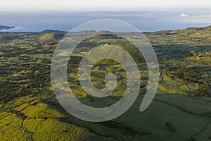 Aerial image of typical green volcanic caldera crater landscape with volcano cones of Planalto da Achada central plateau of Ilha photo