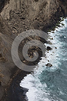 Aerial image of water hitting the black lavacoast of the new land of Capelinos volano after the 1957 volcanic eruptions photo