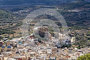 aerial image where you can see the village and the old castle under restoration