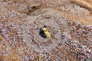 Yellow Landfill compactor at Municipal Solid waste compound.