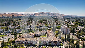Aerial images over residential and commercial real estate in Fremont, California.