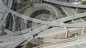 Aerial: Judge Pregerson huge highway connection showing multiple roads, bridges, viaducts with little car traffic in Los