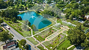 Aerial Lakeside Park with lake and giant fountain beside ideal outdoor wedding location with gardens