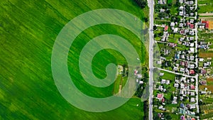 aerial landmark urban outskirts housing residence private living district on edge with a field green vivid colors and beautiful