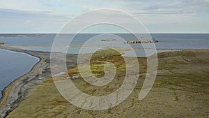 Aerial landscape of coastline Arctic Ocean on background Novaya Zemlya.