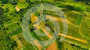 aerial landscape country side agricultural stripped fields in human settlement region space