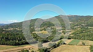 Aerial landscape of the countryside. Fields, gardens, trees, farmland, mountains