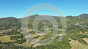 Aerial landscape of the countryside. Fields, gardens, trees, farmland, mountains