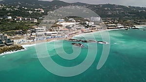 Aerial landscape footage of Batroun coastal city by turquoise sea in Lebanon