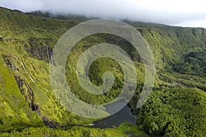 Aerial landscape image of sunset sunrise over PoÃ§o Ribeira do Ferreiro waterfalls and Lagoa dos Patos with its remarkable amazing