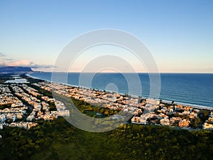 Aerial landscape photo of Recreio dos Bandeirantes beach during sunset, with views of Chico Mendes park