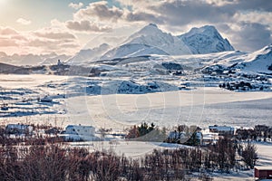 Aerial landscape photography. Amazing evening view of Bostad village, Vestvagoy island, Norway, Europe photo