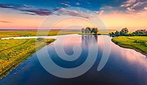 Aerial landscape photography. Fantastic summer sunrise on small lake, Ternopil region.