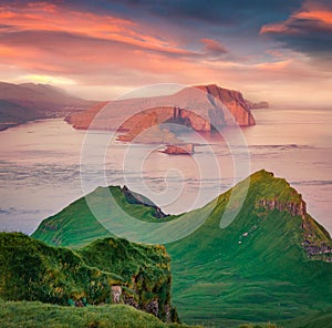 Aerial landscape photography. Fantastic sunrise on Mykines island. Unbelievable morning view of Alaberg cliffs, Faroe Islands, Den