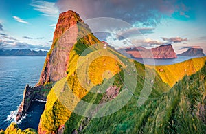 Aerial landscape photography. Unbelievable morning view of Kallur Lighthouse, Kalsoy island