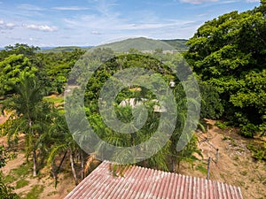 Aerial landscape of rainforest and hut roof in Bom Jardim during summer in Mato Grosso