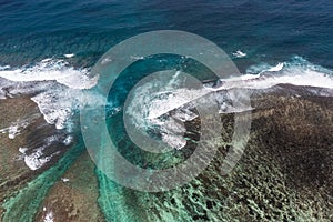 Aerial landscape tow view of beach and oceanic coastline with a reef who protects the Island and the beach