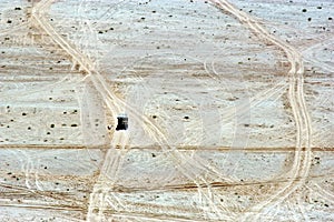 Aerial landscape view of 4WD vhicle journey over off road trail