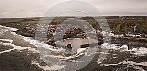 Aerial landscape view of Craster Harbour and village in Northumberland