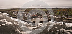 Aerial landscape view of Craster Harbour and village in Northumberland photo