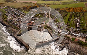 Aerial landscape view of Craster Harbour and village in Northumberland photo