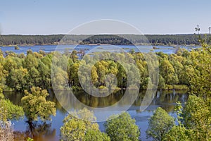 Aerial landscape view on Desna river with flooded meadows and fields. View from high bank on annual spring overflow