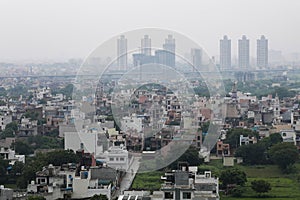 Aerial landscape view of Dwarka Expressway, showing the contrast of villages and tall building