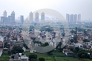 Aerial landscape view of Dwarka Expressway, showing the contrast of villages and tall building