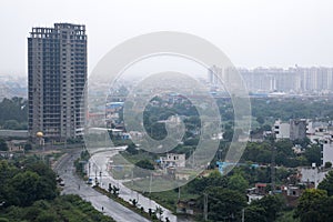 Aerial landscape view of Dwarka Expressway, showing the contrast of villages and tall building