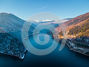 Aerial landscape view of lake Rausor in late winter