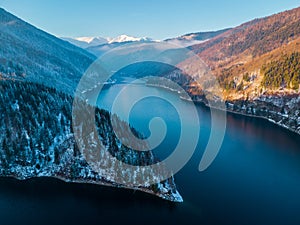 Aerial landscape view of lake Rausor in late winter