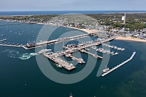 aerial landscape view of MacMillan Pier and Provincetown Marina in front and Provincetown