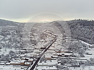 Aerial landscape view of a mountain village in winter